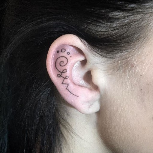 Inner Ear Tattoo by @fmdtattoos