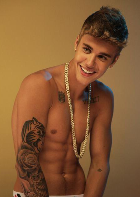 Justin Bieber tattoo posing with chain