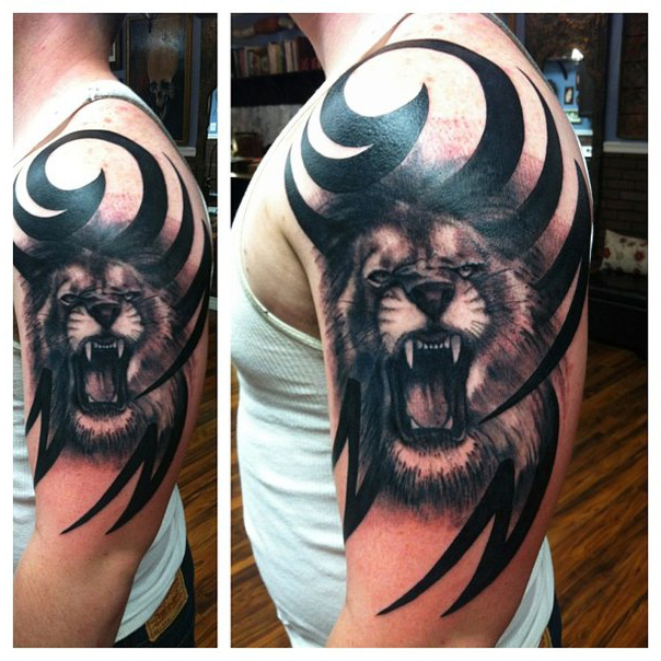 Shoulder growling lion tribal tattoo