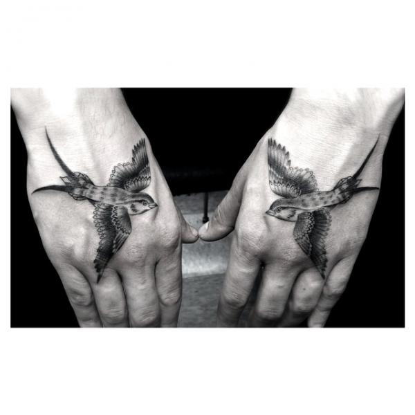 Two Identical Swallows Graphic tattoo by Dr Woo on Hands