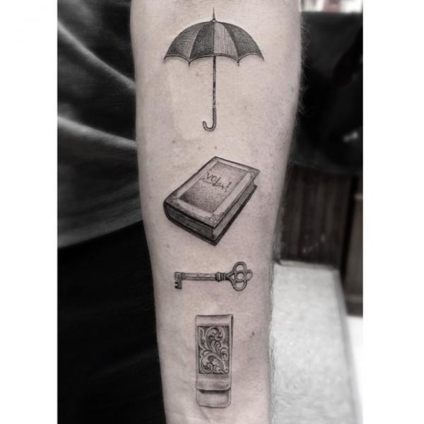 Umbrella Book and Key Graphic tattoo by Dr Woo