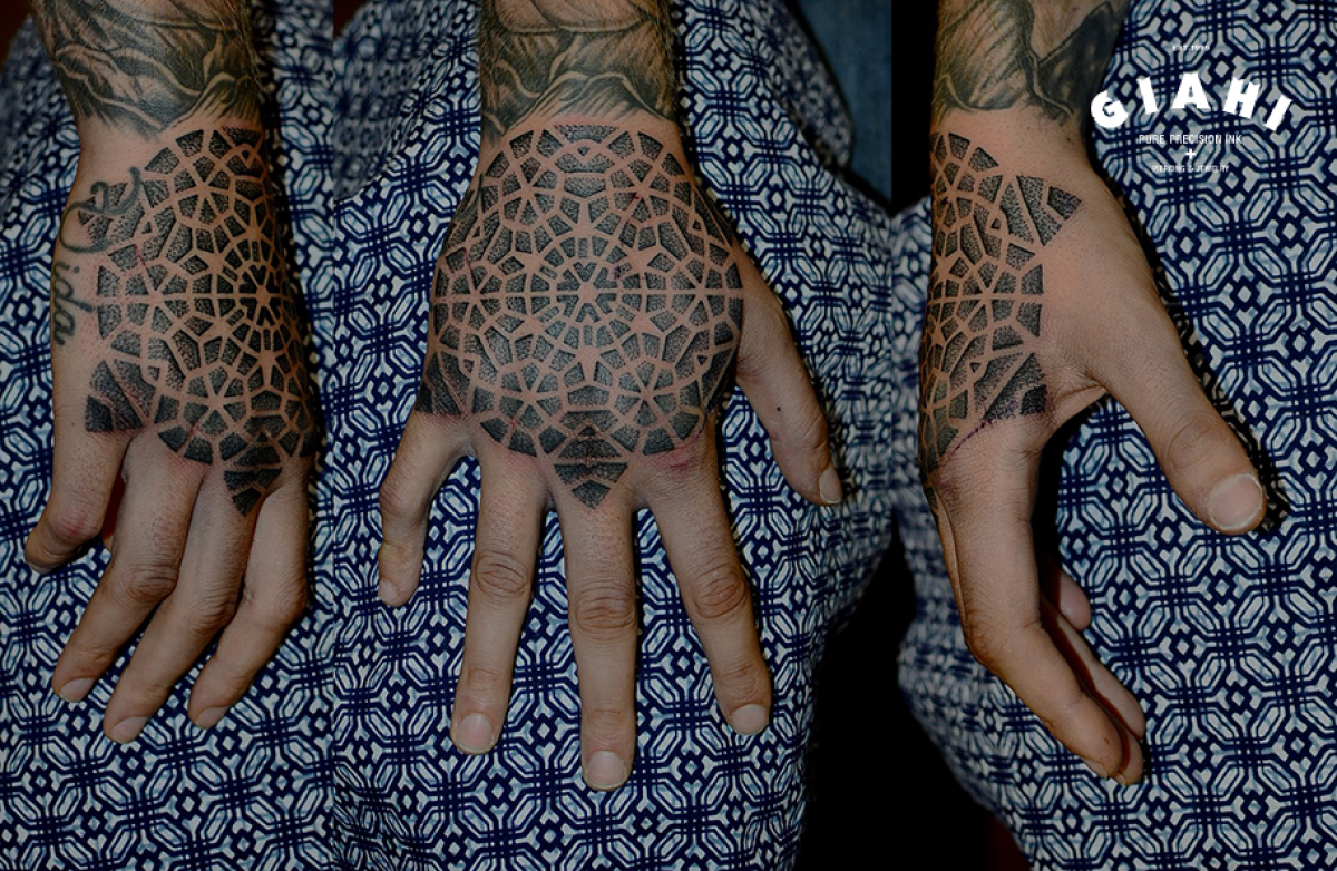 Back of Hand Dotwork Kaleidoscope tattoo by Andy Cryztalz