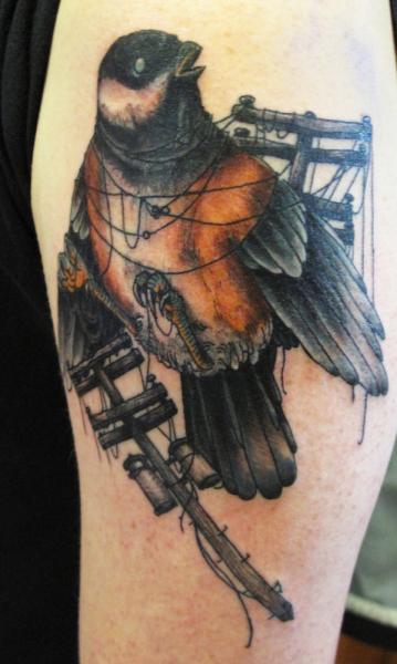 Bird Caught in Wires Realistic tattoo by Three Kings Tattoo