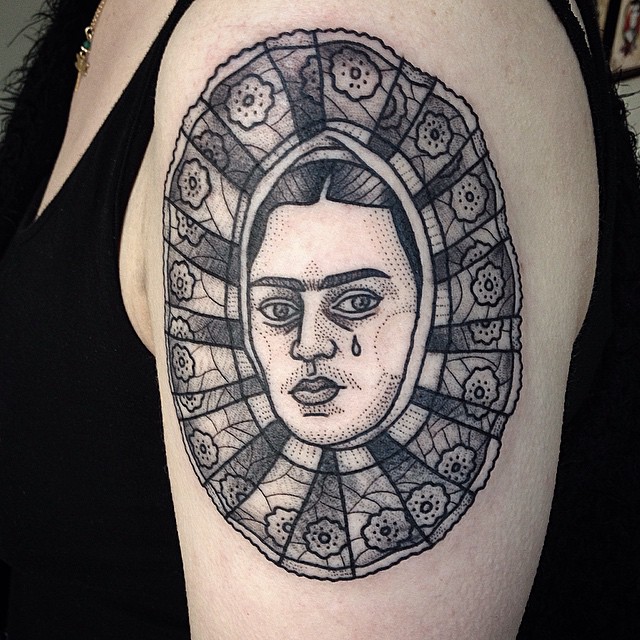 Stained-Glass Face Tear Shoulder tattoo