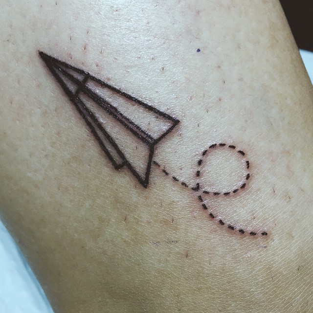 Tiny Paper Plane tattoo by Thomas Sinnamond