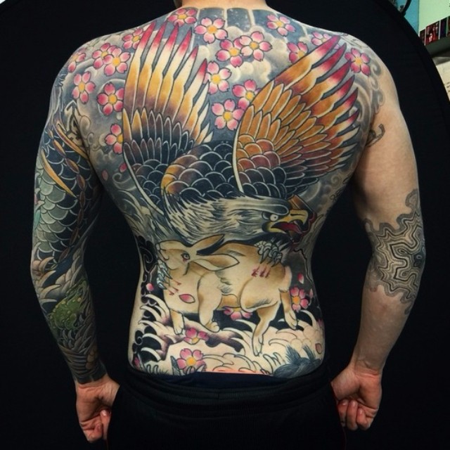 Hare Holding Eagle Full Back tattoo