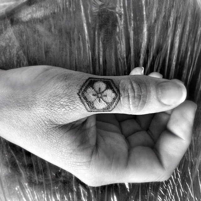 Thumb Finger Trefoil tattoo