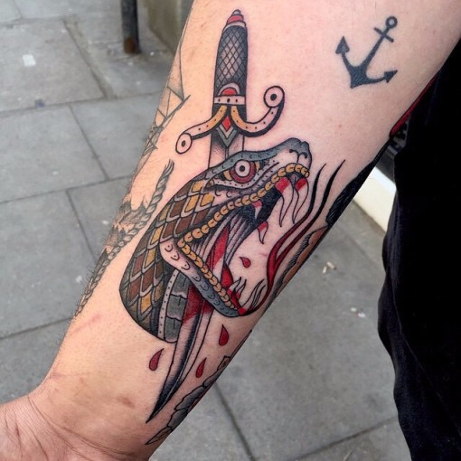 Arm Stabbed Snake New School Tattoo - Best Tattoo Ideas Gallery