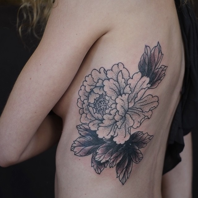 Flower Outlines Rib Tattoo