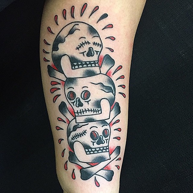 Three Skulls Tattoo on Arm