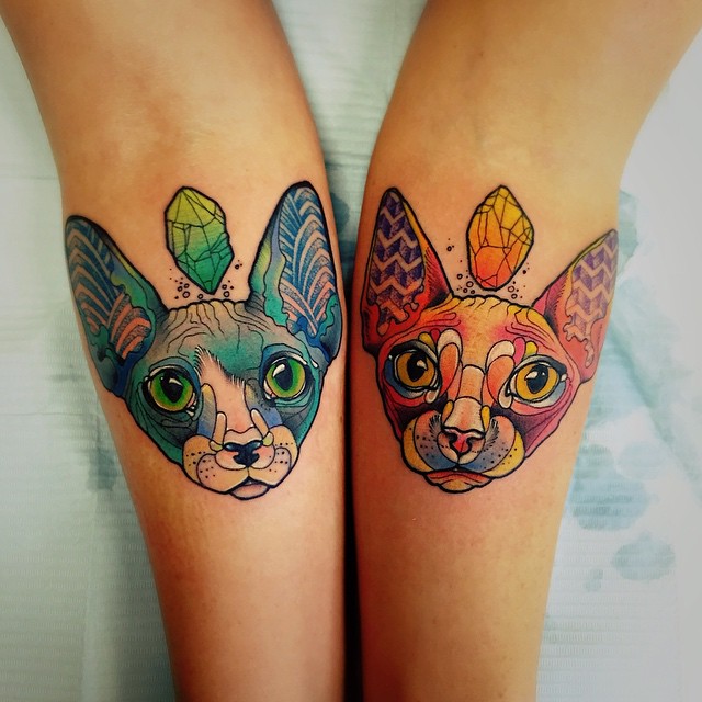 Two Sphynx Cats Matching Tattoos on Arms