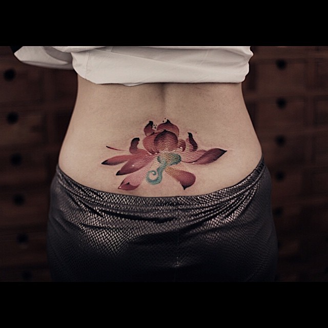 Watercolor Lotus Lower Back tattoo