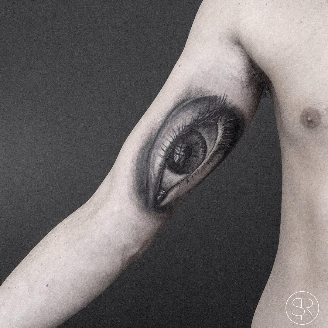 Graphic Realistic Eye Tattoo on Arm