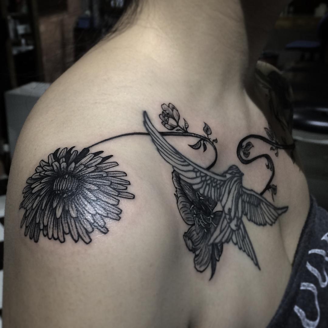 Swallow on Chest and Flower on Shoulder Tattoo