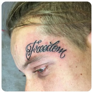 Freedom Lettering Tattoo on Face - Best Tattoo Ideas Gallery