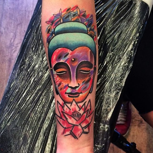 space textured Buddha face tattoo