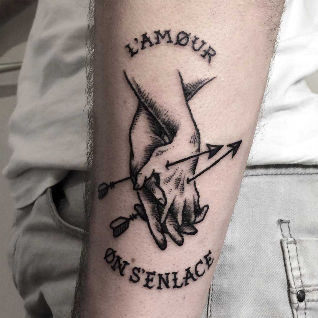 a symbolic love tattoo on arm