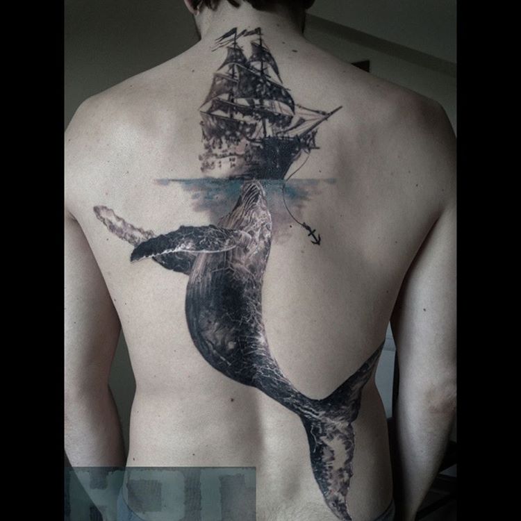 a ship and whale tattoo on back