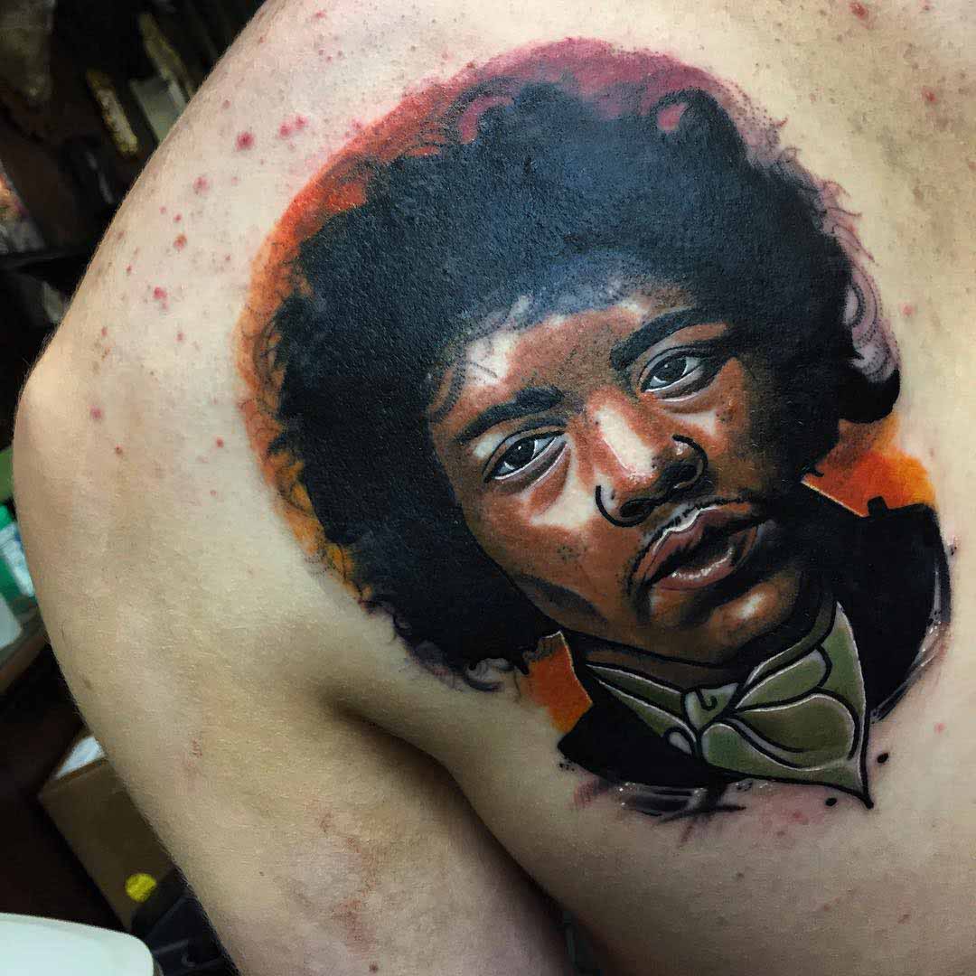 a shoulder blade tattoo potrait of Jimi Hendrix