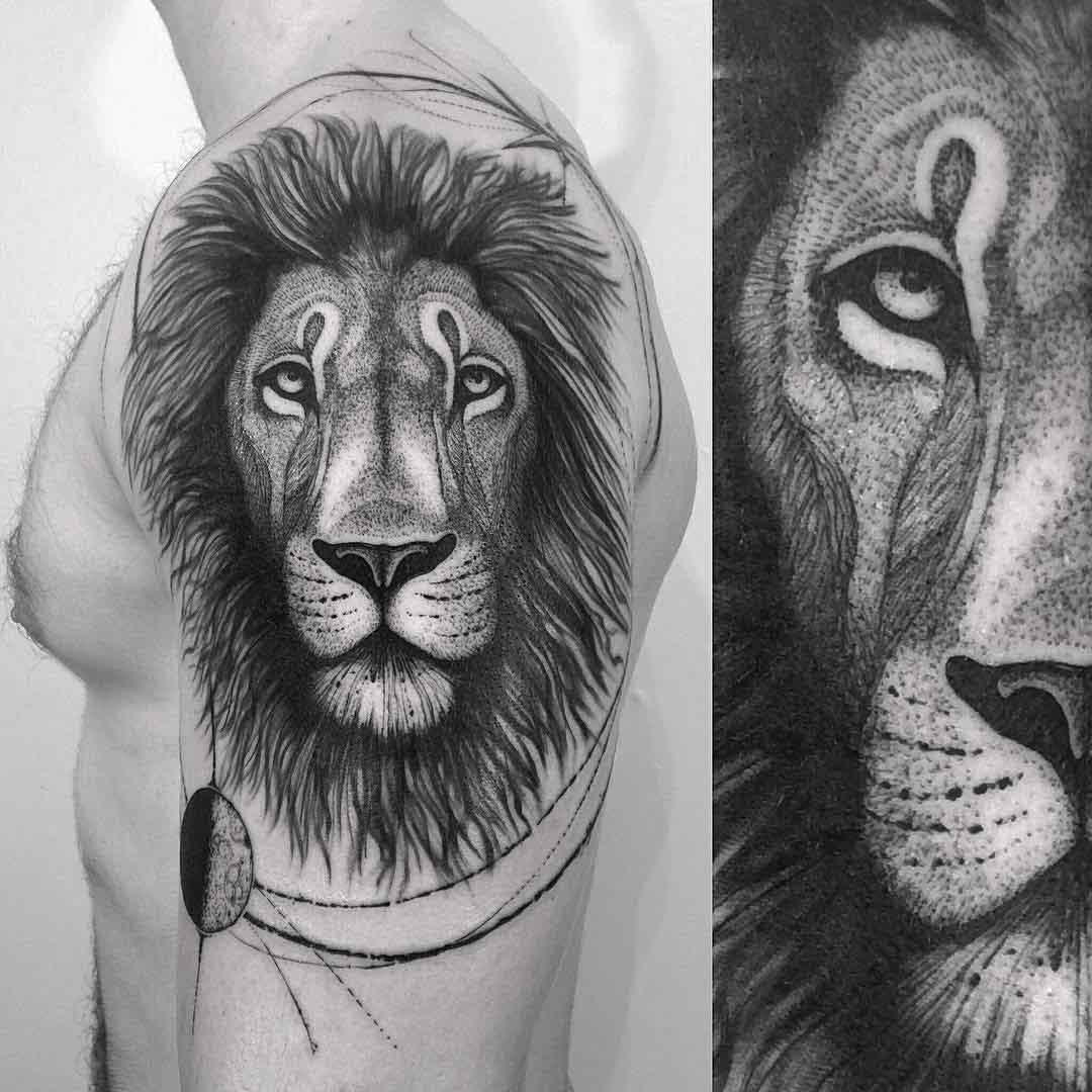 lion face tattoo on shoulder