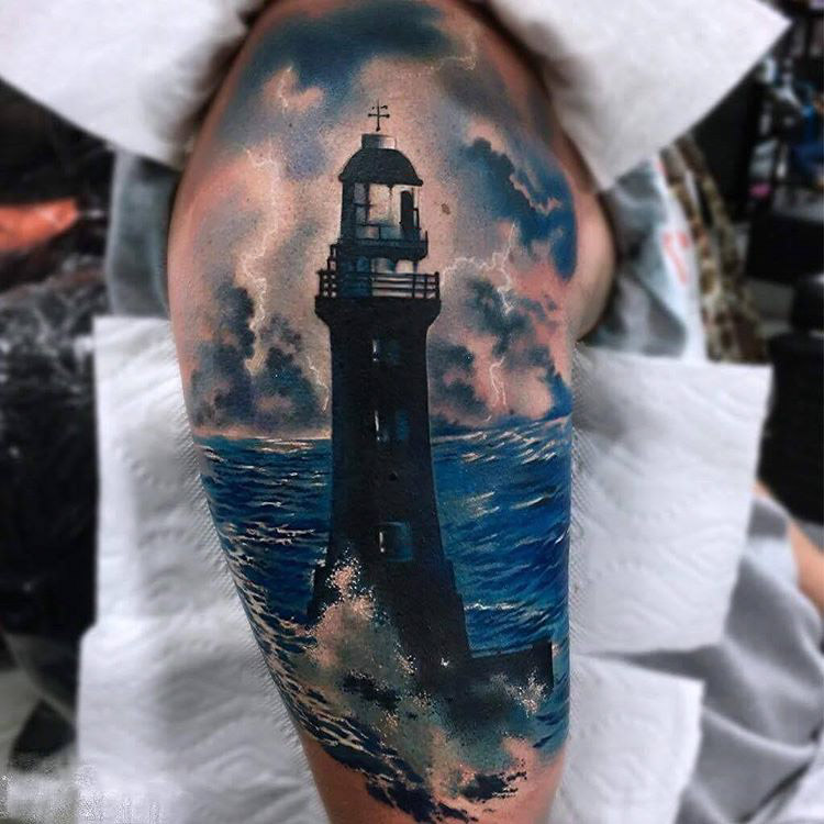 realistic lighthouse tattoo on shoulder