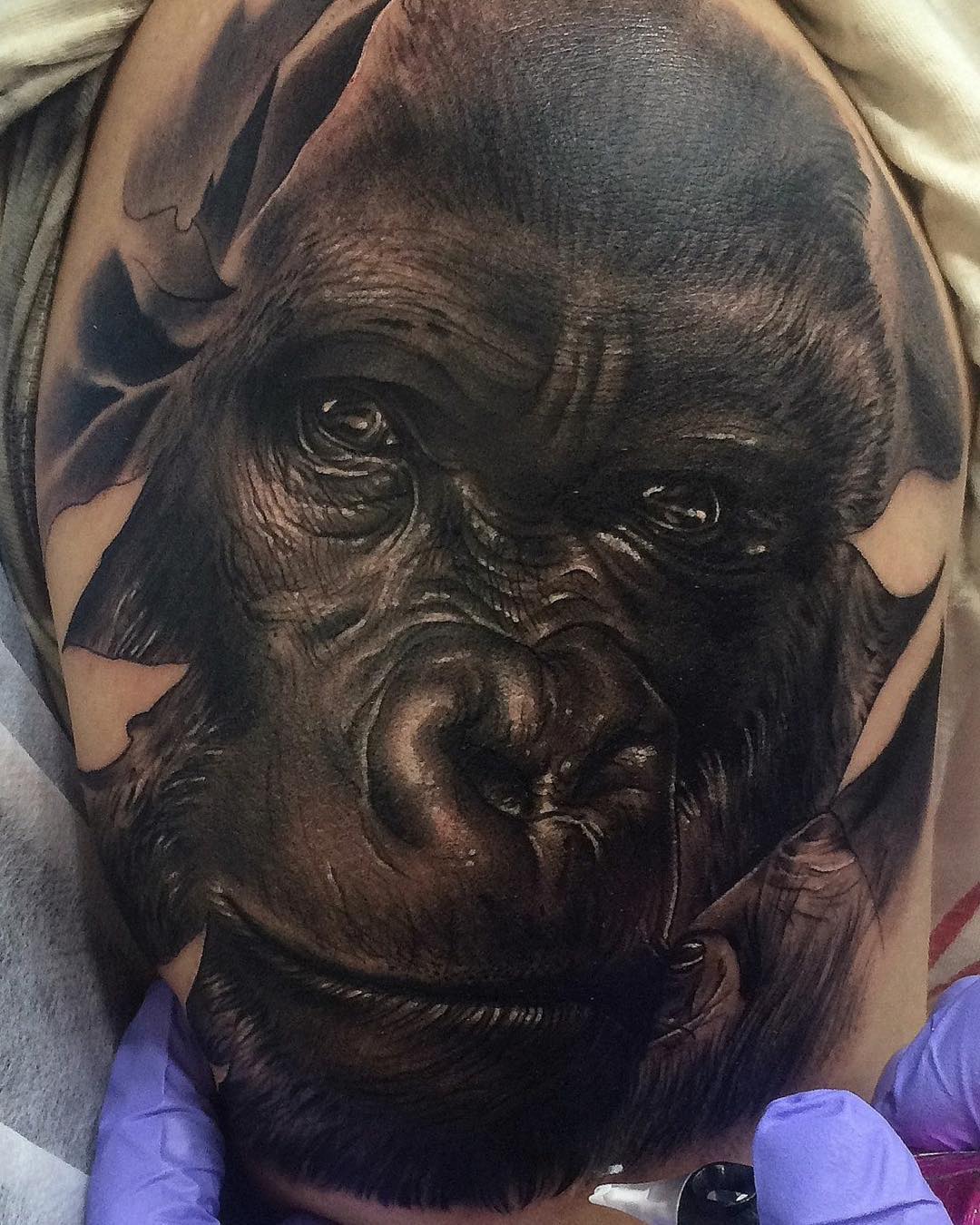 realistic tattoo - close-up face of gorilla in black and gray shades