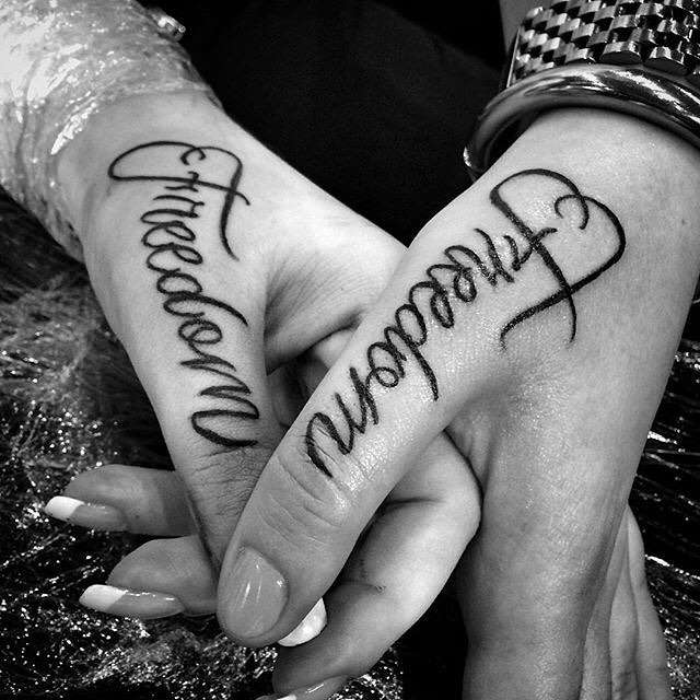 interesting tattoo idea of the lettering for couple done on their thumbs