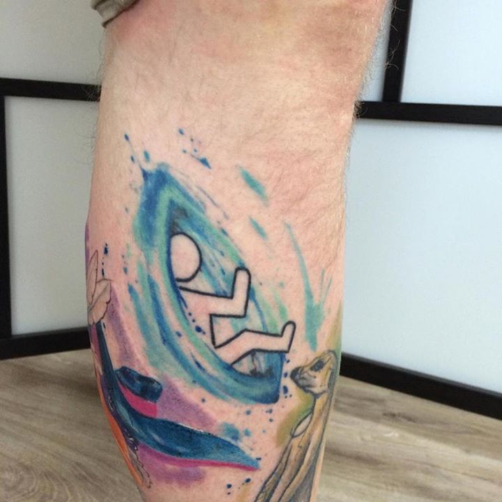 a man comming out of a blue portal. Portal Game inspired tattoo idea