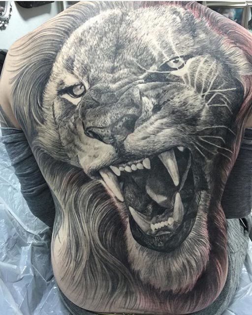 black and grey realistic lion tattoo on back