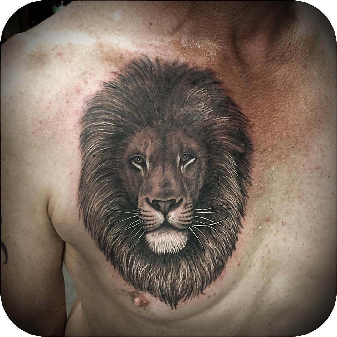 lion head tattoo on chest
