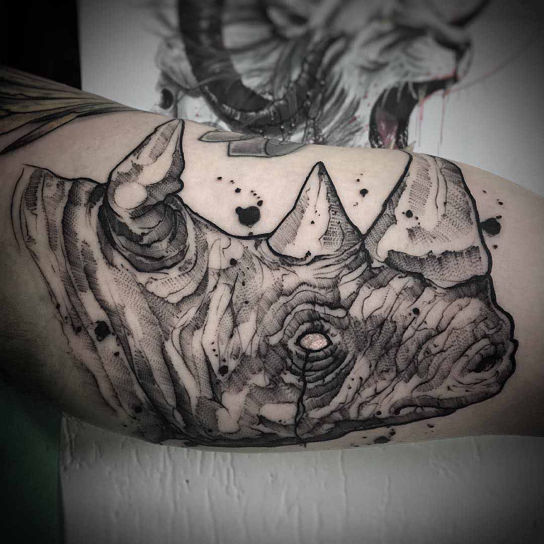 head of rhino tattoo on arm