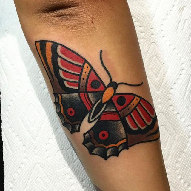 traditional butterfly tattoo on arm