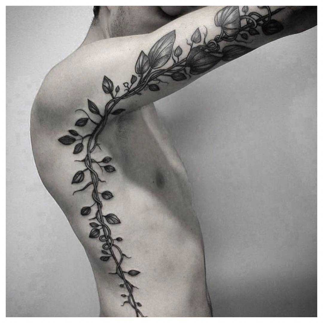ribs to arm vine tattoo