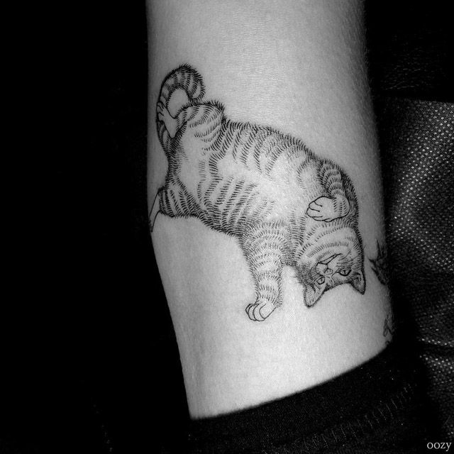 playing cat tattoo