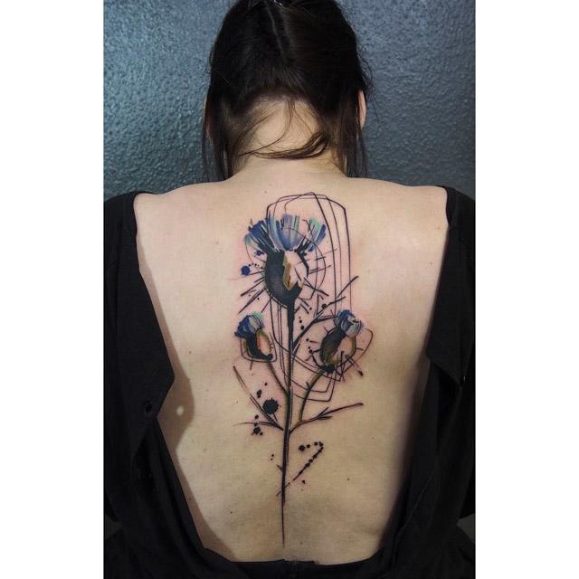 cool back flower tattoo