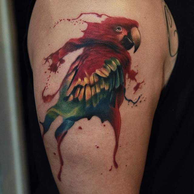 watercolor parrot tattoo on shoulder