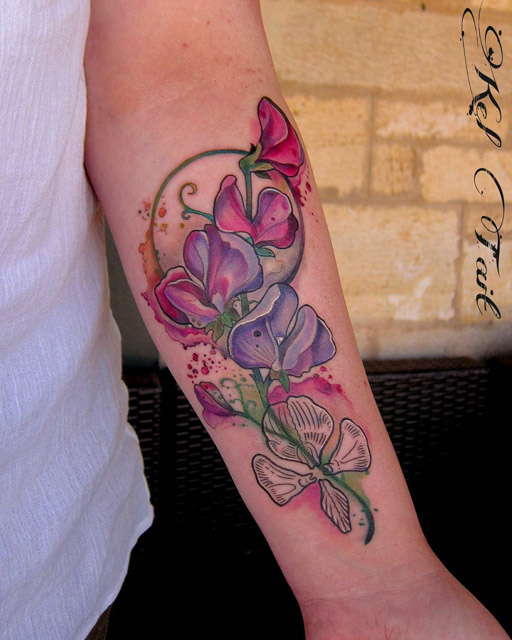 beutiful flowers tattoo on forearm