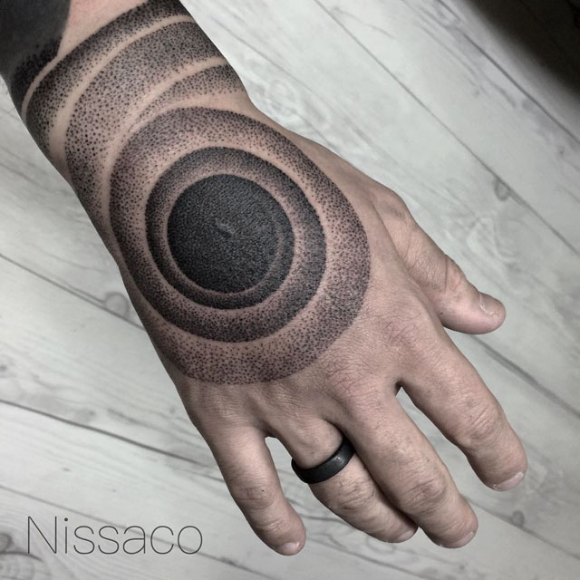 dotwork spiral tattoo on hand