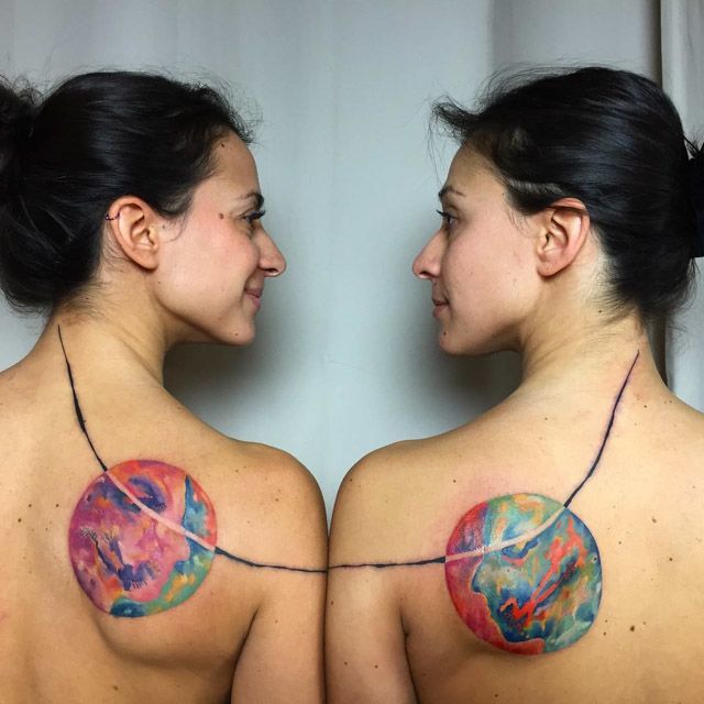 sister twins tattoos on shoulder blades