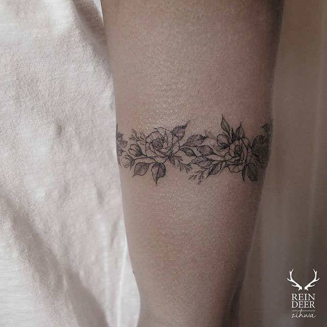 flower band tattoo around the arm