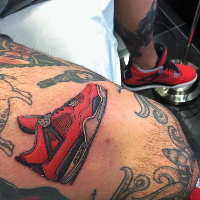 red running shoe tattoo