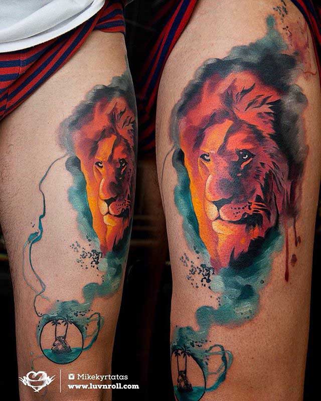 watercolor lion tattoo on thigh