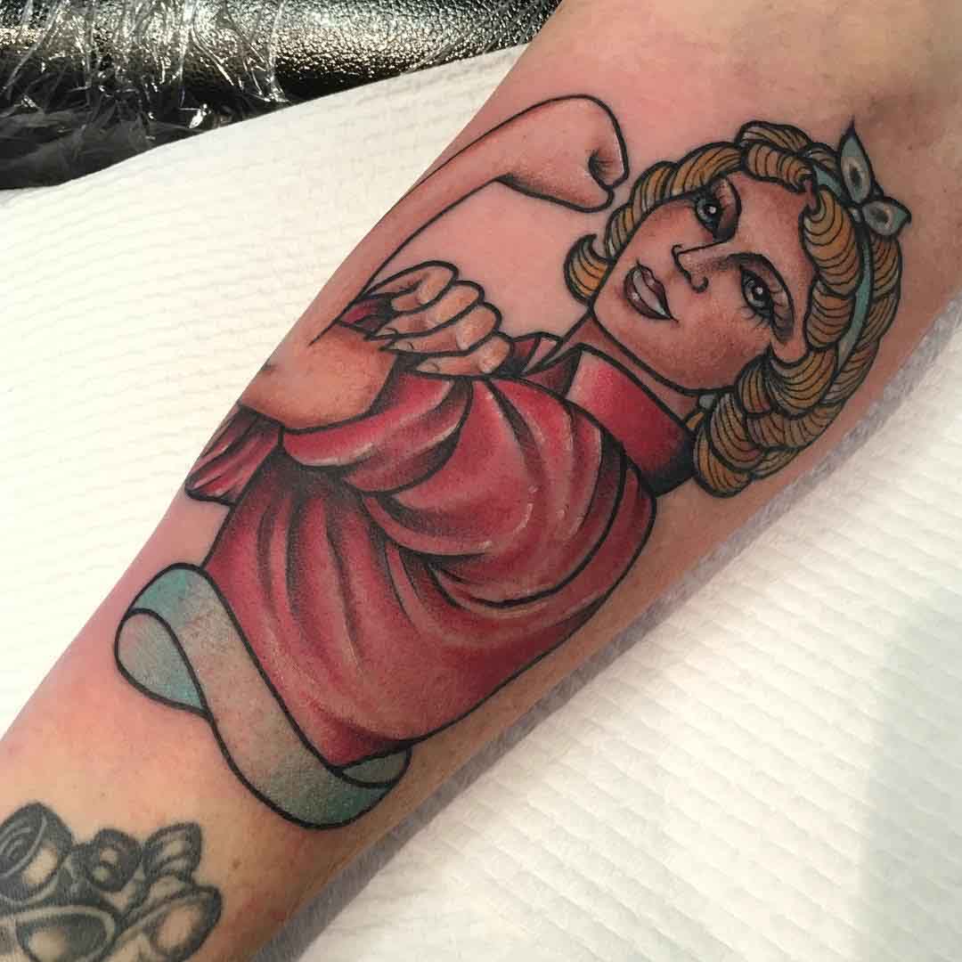 Rosie Riveter styled tattoo of a relative