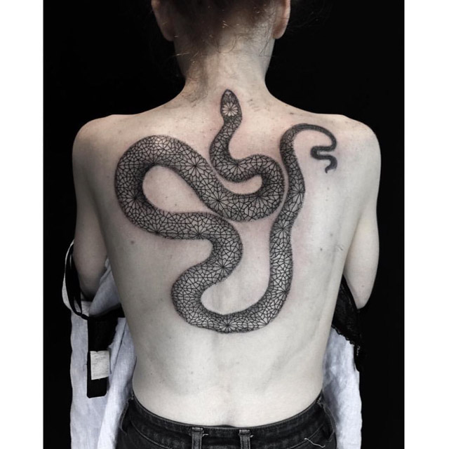 patterned snake tattoo on back
