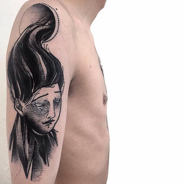 black and grey tattoo on shoulder