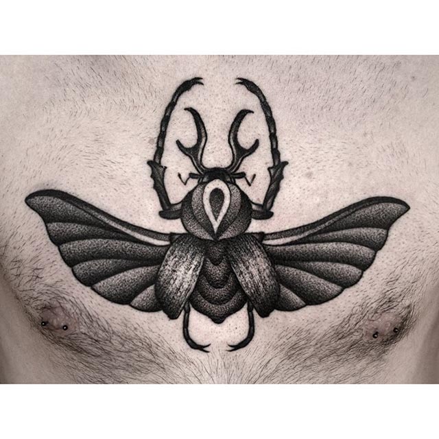 bug tattoo on chest