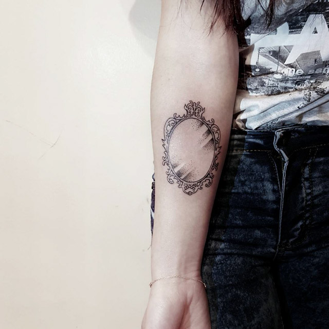 mirror tattoo on arm