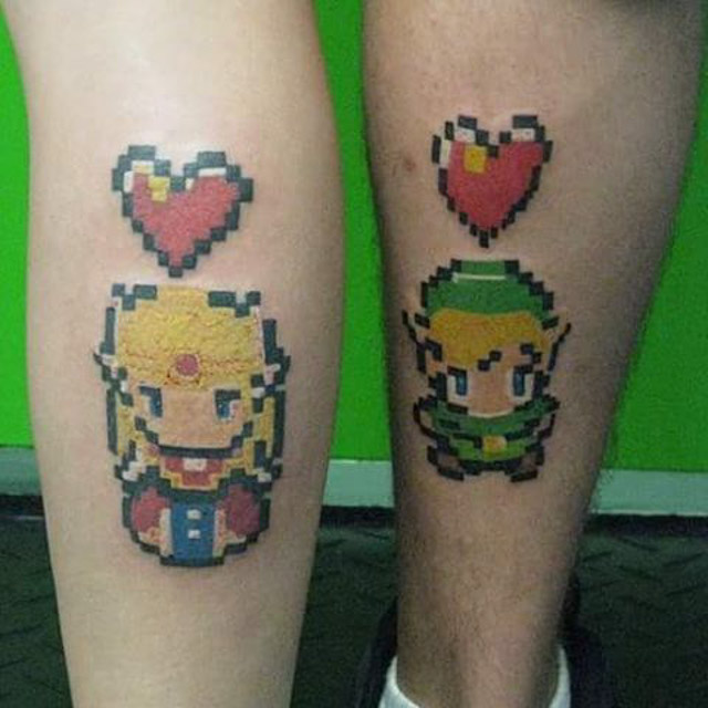 A Zelda and Link couple tattoo! Done by Kenny Tetrault
