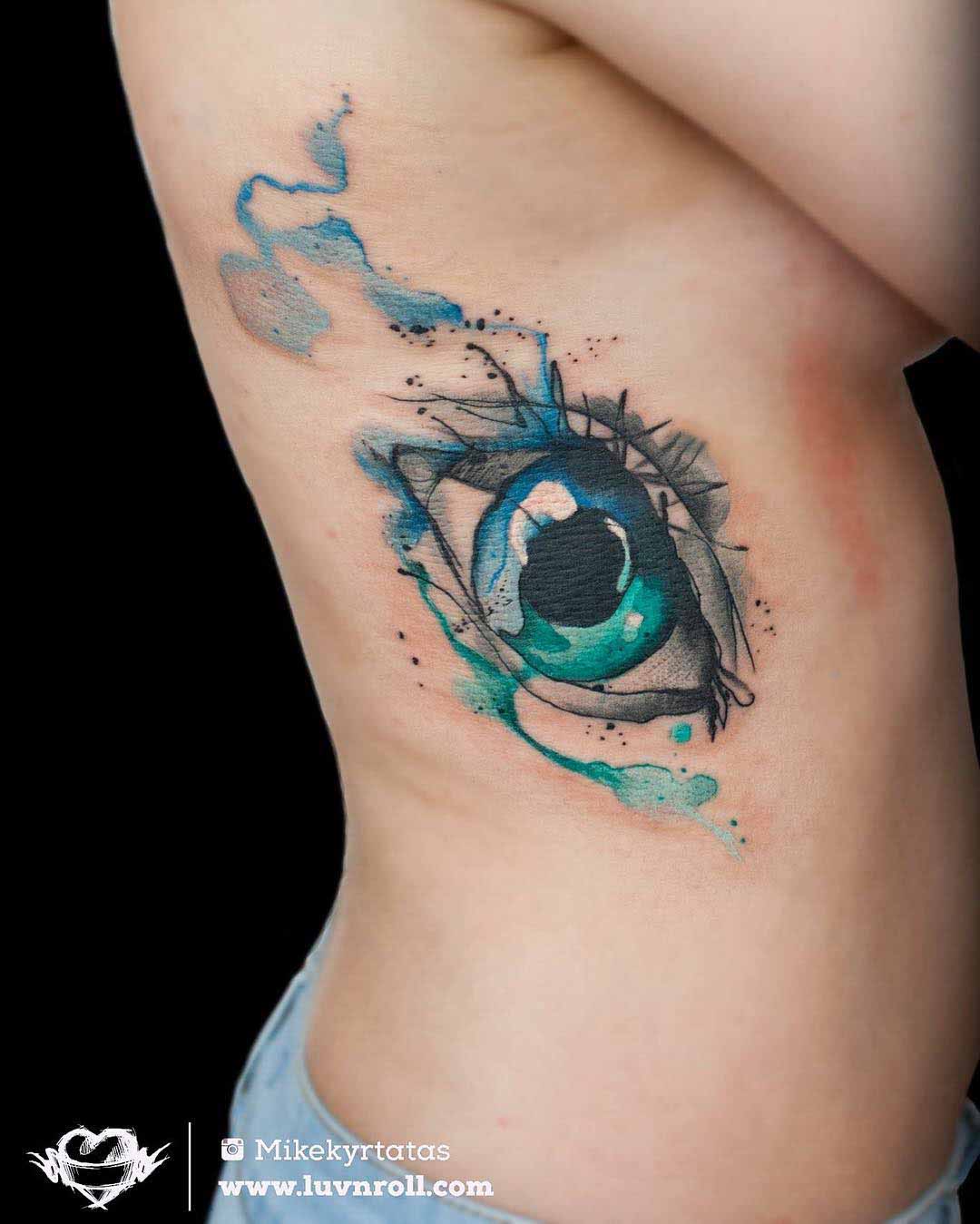 watercolor rib tattoo eye
