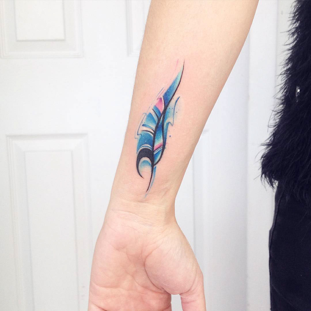wrist feather tattoo blue